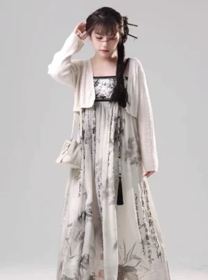 Front three-quarter view of ink wash Tang Dynasty Hanfu maxi dress with cream cropped knit cardigan and bamboo calligraphy print