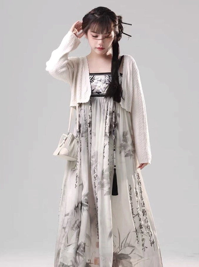 Front three-quarter view of ink wash Tang Dynasty Hanfu maxi dress with cream cropped knit cardigan and bamboo calligraphy print