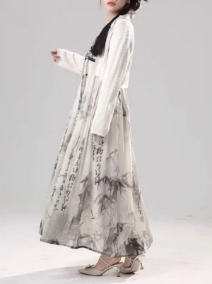 Side view of modern Tang style Hanfu matching set with flowing printed maxi dress and open front cream knit cardigan