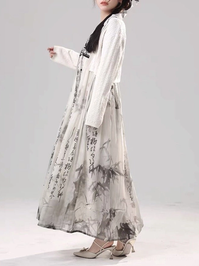 Side view of modern Tang style Hanfu matching set with flowing printed maxi dress and open front cream knit cardigan