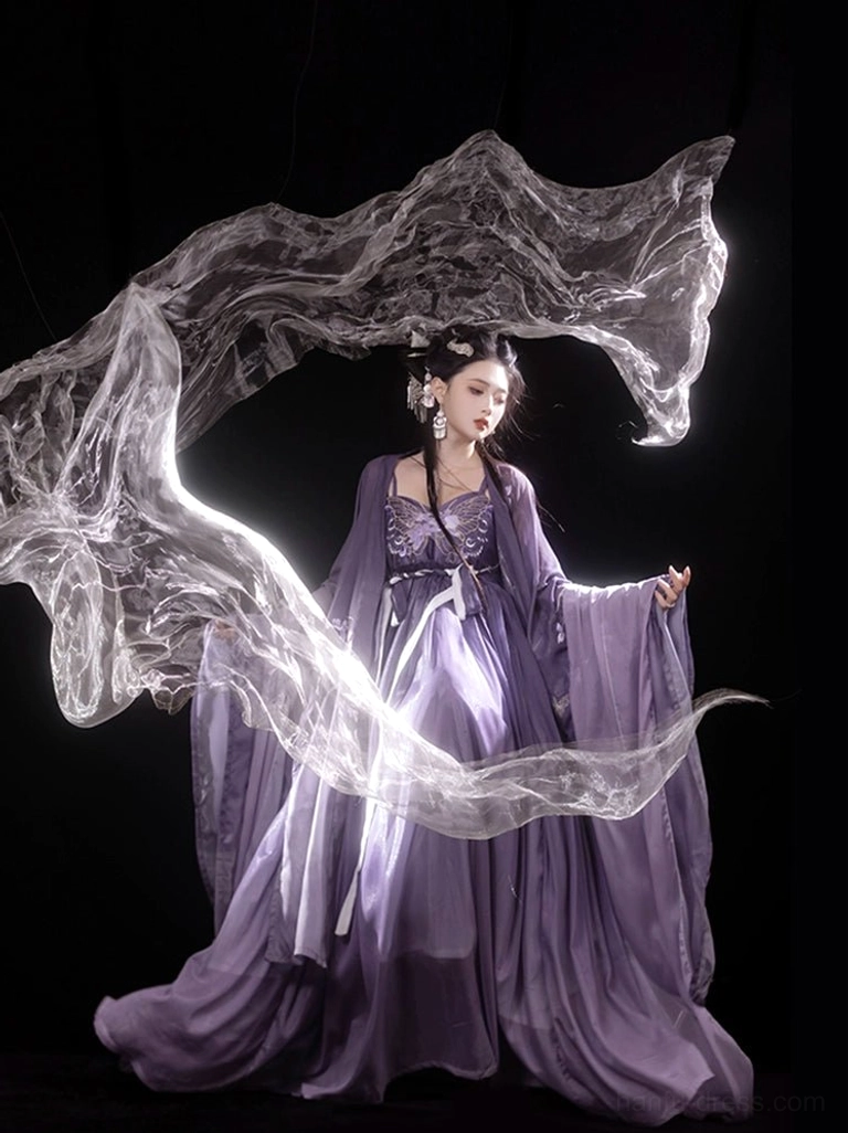 Side full-body view of an Iris Butterfly purple Hanfu Heziqun outfit showing the matching waist sash, wide flowing sleeves, and elegant floor-length chiffon skirt