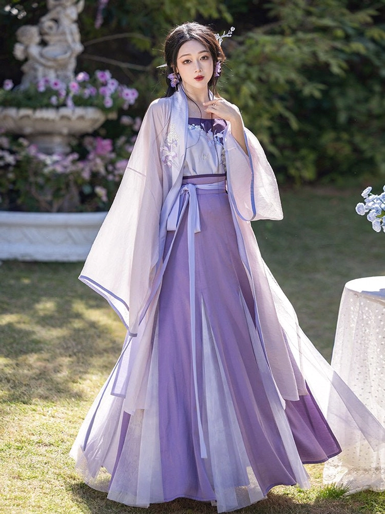 Iris purple Song Dynasty Hanfu full set with lavender cardigan, embroidered camisole and flowing ten-panel wrap skirt in a sunlit garden