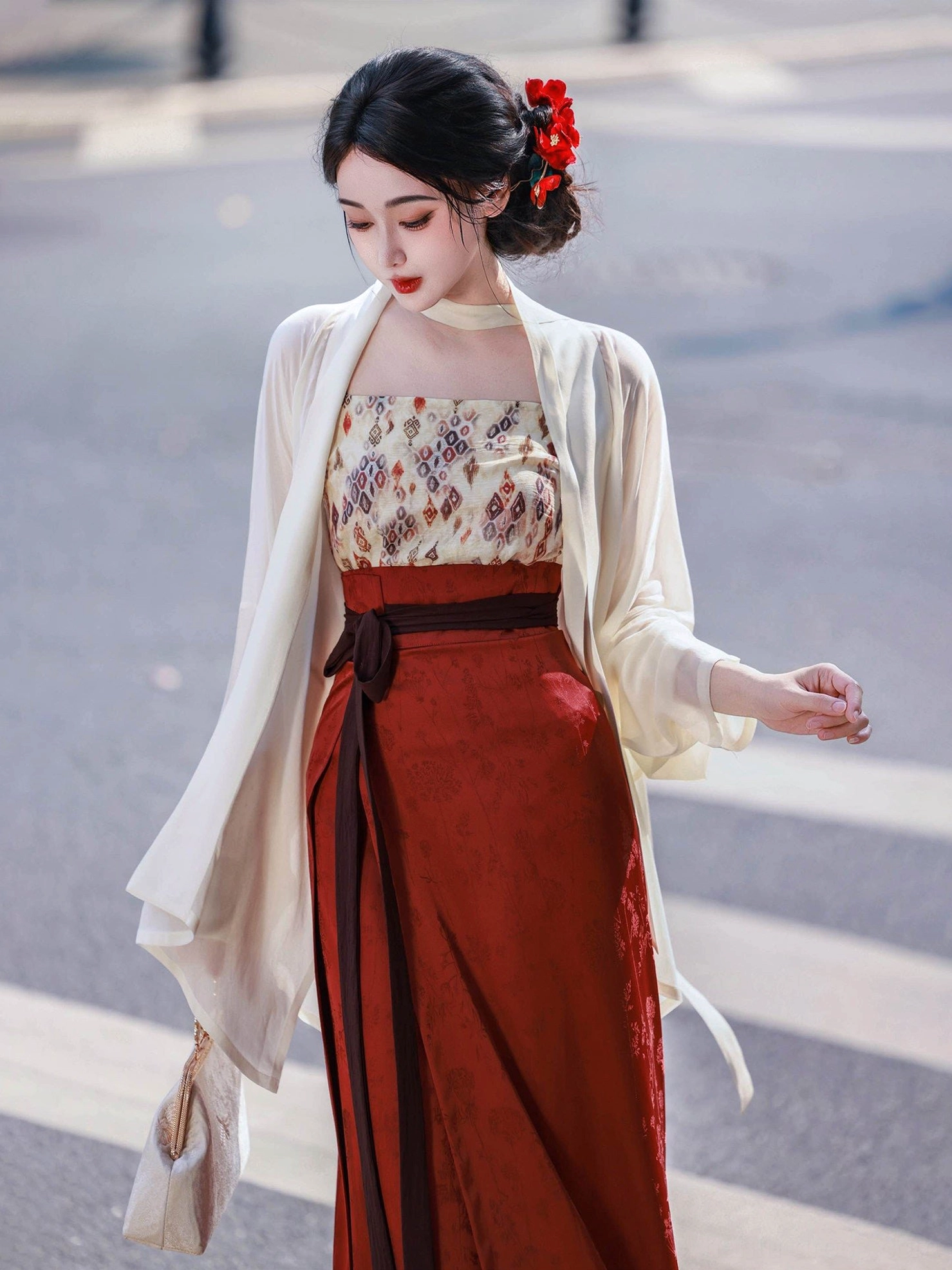 Side wearing view of the Jade Beauty modern Hanfu full set with cream outer top, dark red wrap skirt, matching waist sash, and traditional Chinese styling