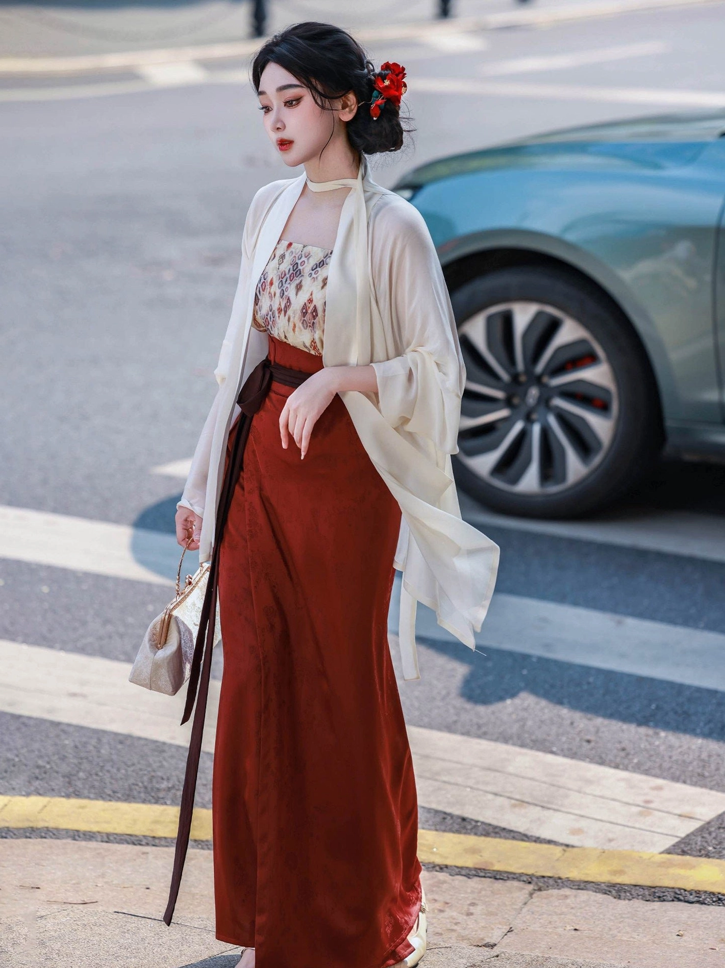 Side view of a flowing Song Dynasty Hanfu outfit with sheer cream wing-sleeve top, beige camisole, reddish brown wrap skirt, and traditional-inspired styling