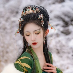Jade Butterfly Spring Hanfu hair accessories set worn with green traditional Chinese Hanfu in a snowy outdoor setting