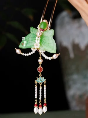 Jade-look butterfly tassel hair pin with green gemstone-style details red accents white pearl strands and lotus-inspired decoration for Chinese Hanfu hairstyles