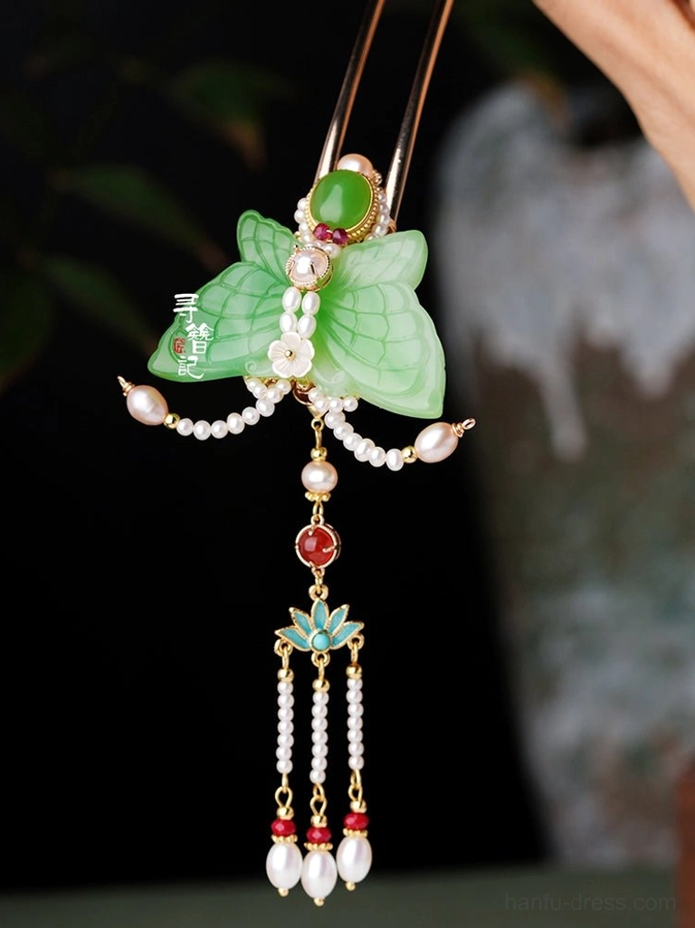 Jade-look butterfly tassel hair pin with green gemstone-style details red accents white pearl strands and lotus-inspired decoration for Chinese Hanfu hairstyles