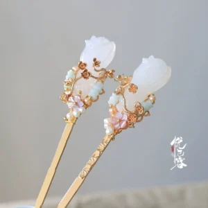 Jade orchid Rongzi Chinese hair pin with white floral ornament gold carved details and colorful beads displayed on a light gray background