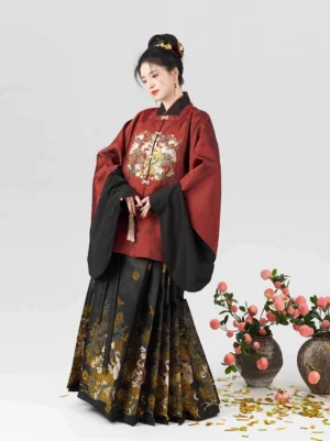 Ming style Chinese New Year dress Hanfu with black mamian skirt gold peach floral print and layered wine red top side front view