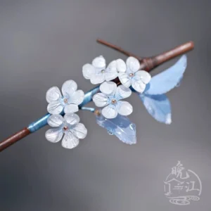 Jade Skies plum blossom Chinese hair stick with translucent pale blue white flowers, blue leaves, gold centers, and brown wooden stick