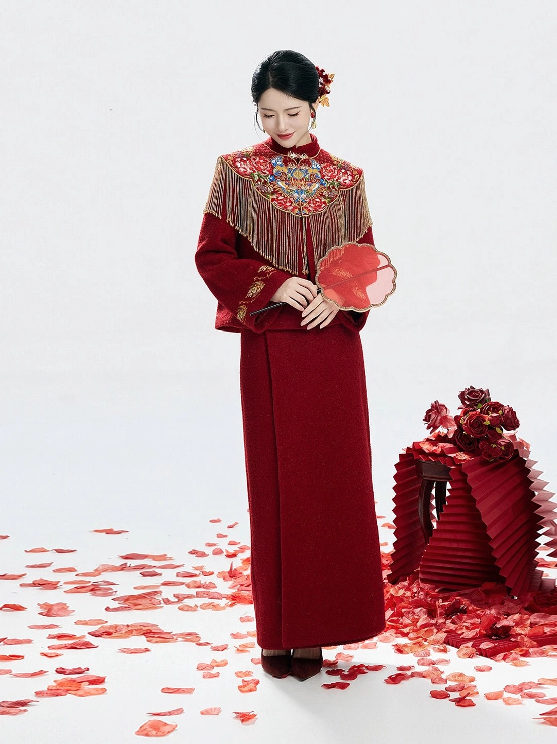 Wine red bridal tea ceremony hanfu side front view with ornate cloud shoulder embroidery golden tassels and floral hairpins