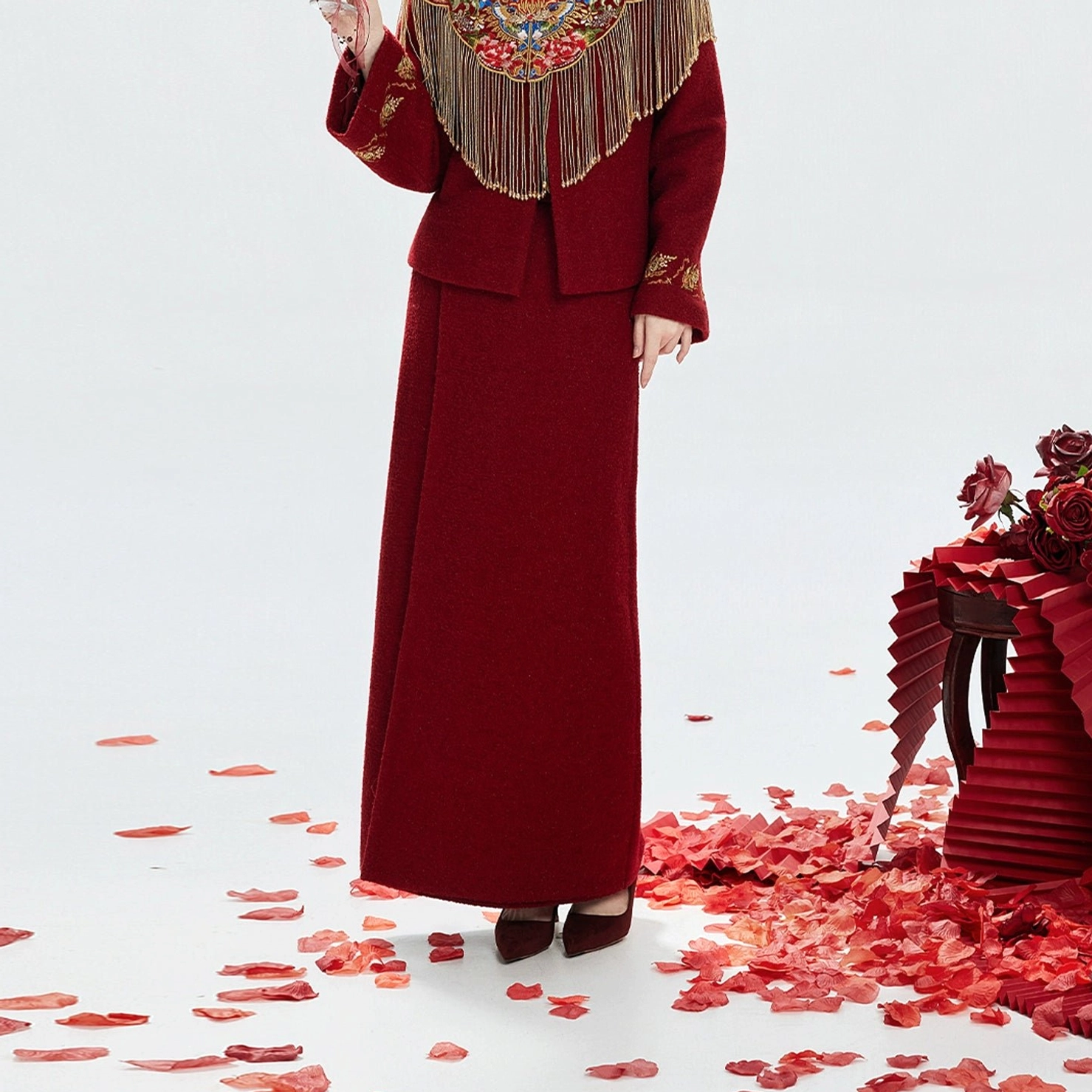 Back view of wine red Chinese wedding hanfu skirt and jacket with embroidered cloud collar and golden tassels