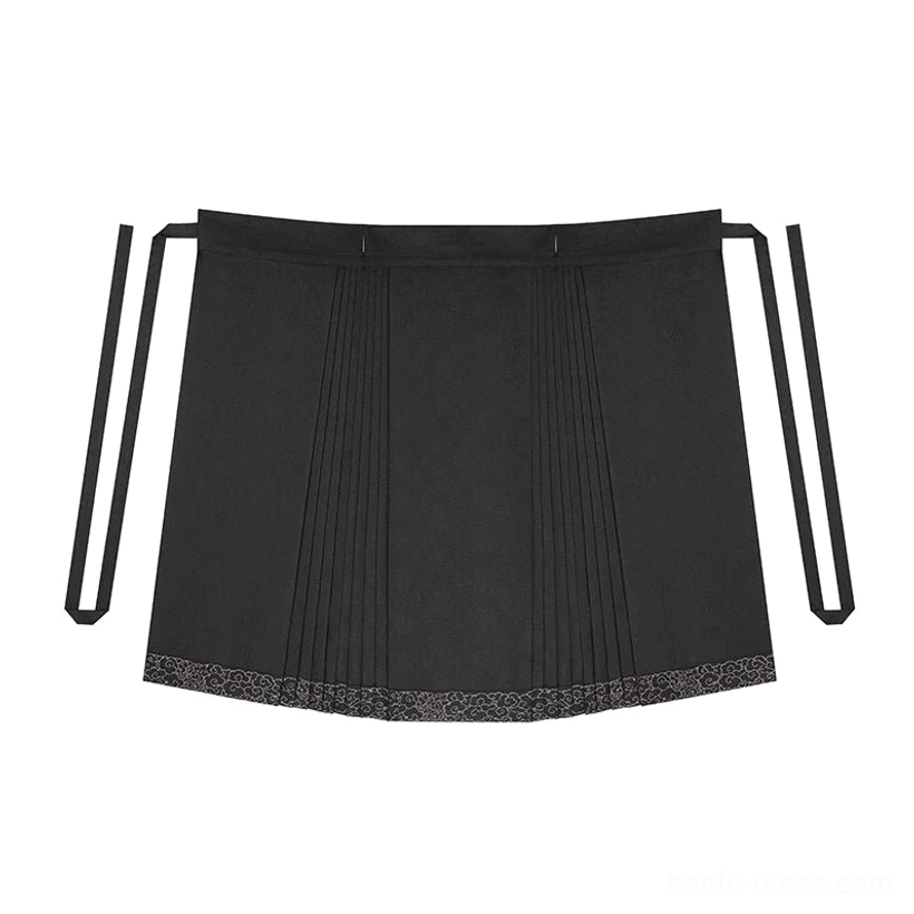 Flat lay of Jinwu black Ming Dynasty mamianqun skirt with pleats, tie waist and embroidered gold decorative hem
