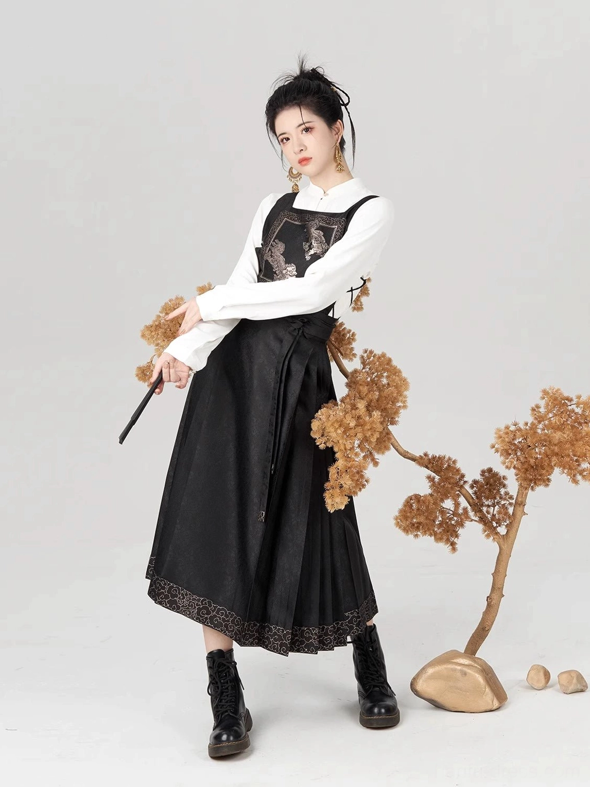 Front view of Jinwu Ming Dynasty Hanfu Golden Crow embroidered vest with black pleated mamianqun skirt