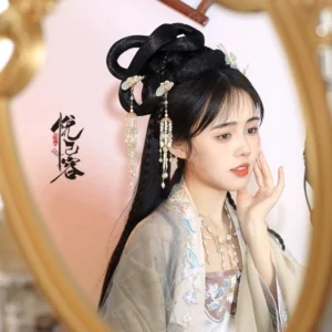 Hanfu model wearing Juhua floral tassel hairpin in a traditional Chinese coiled updo side portrait
