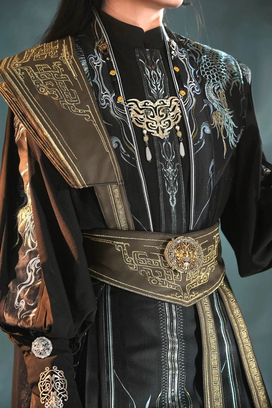 Close-up of King Lanling Xianxia Hanfu chest ornament with silver mythical beast decoration, jade pendants and dragon embroidery