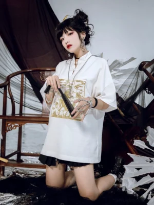 Oversized white modern Hanfu shirt with golden Kirin embroidery, traditional frog button stand collar, styled with silver jewelry and folding fan