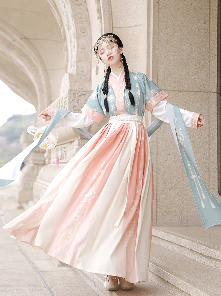 Tang Dynasty inspired Lantern Fate Hanfu set side view featuring teal half-sleeve beizi pink trim and flowing pink cream pleated ruqun skirt