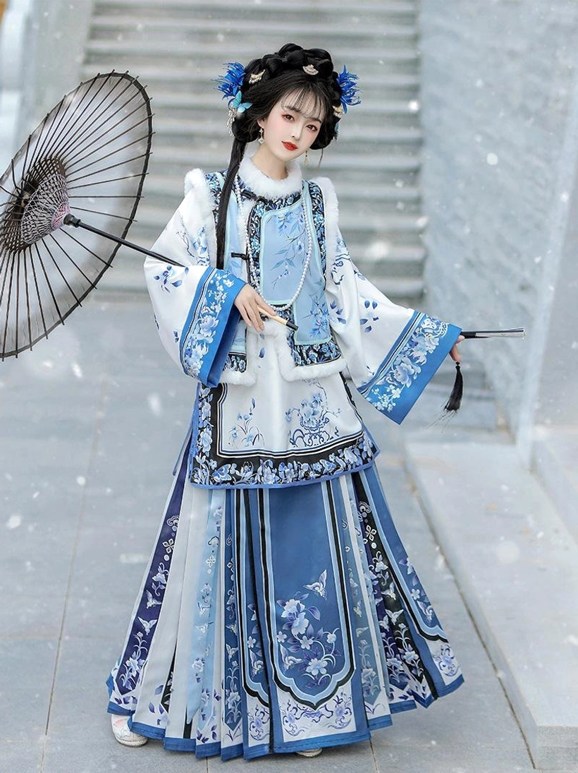Blue and white porcelain inspired Late Qing Han women winter outfit with embroidered layers fur style collar trim and oiled paper umbrella side view