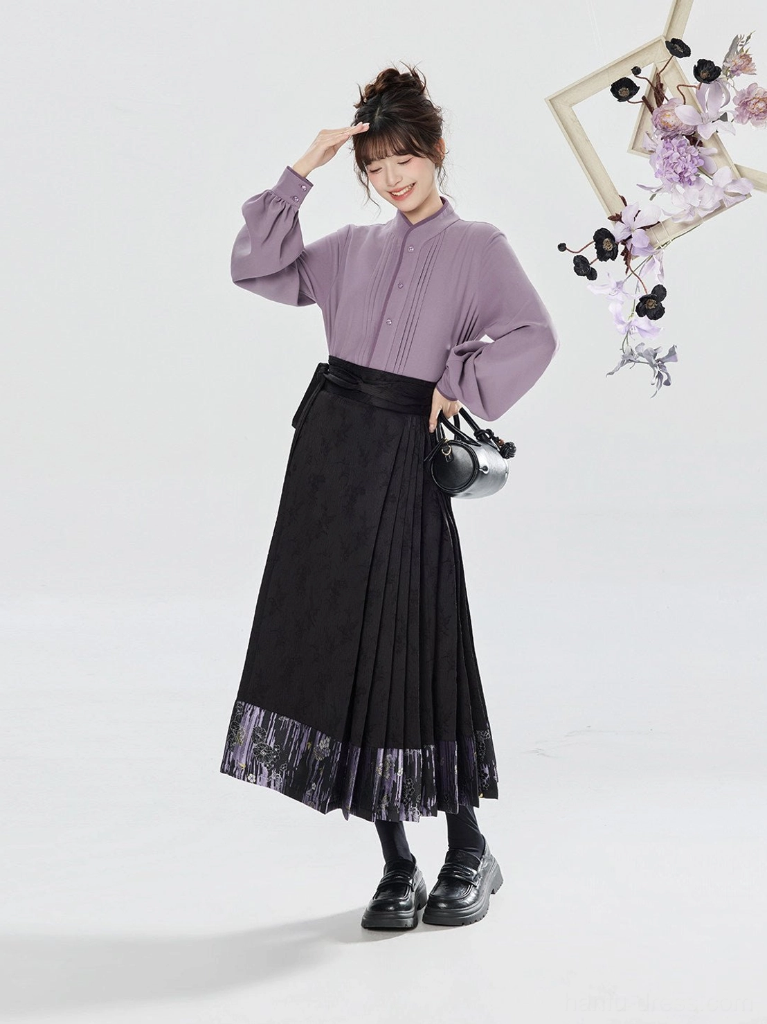 Side view of a muted lavender hanfu blouse with pleated stand collar and lantern sleeves styled with a black mamianqun skirt