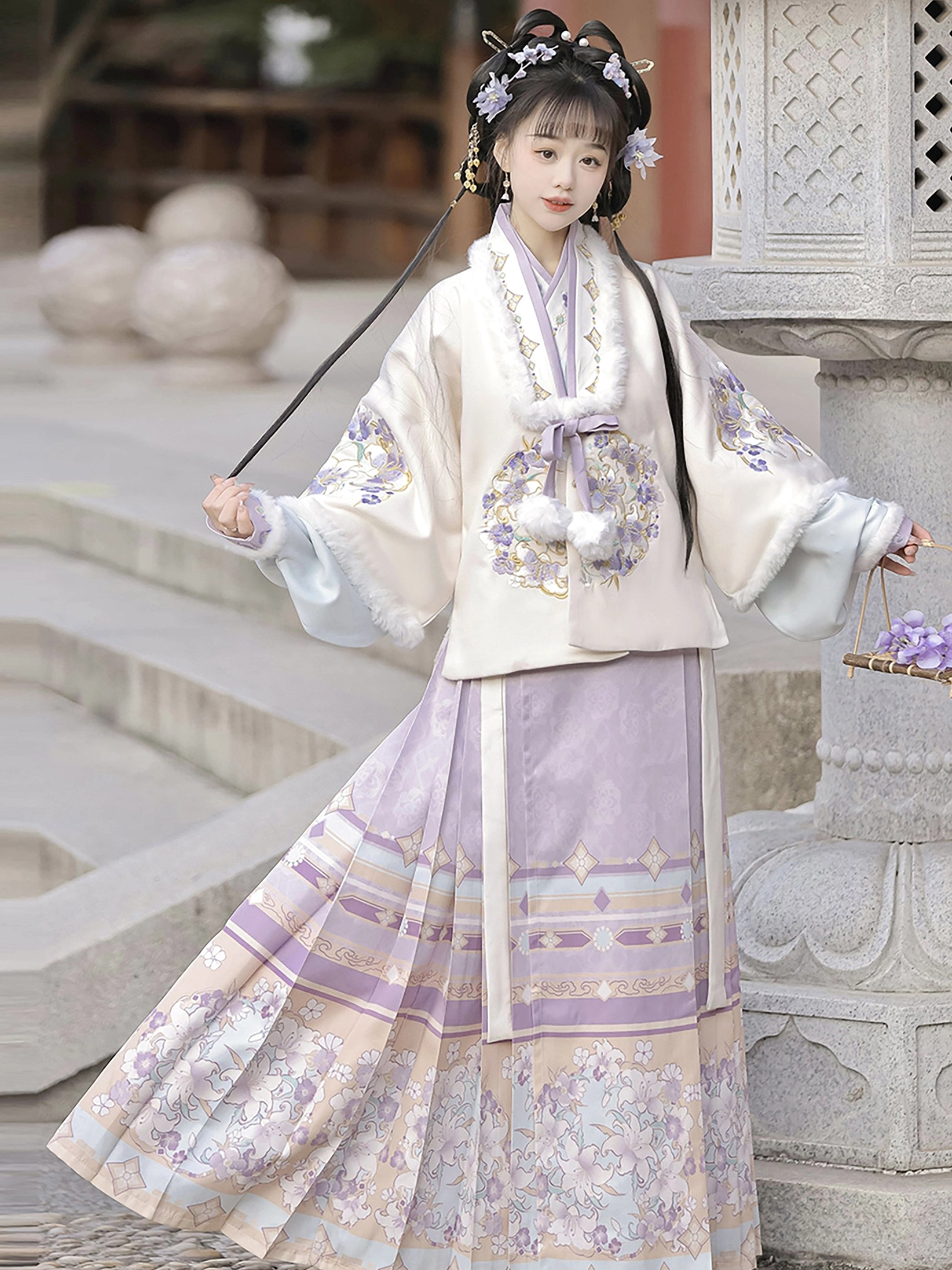 Side view of lavender Ming Dynasty Hanfu outfit with embroidered jacket, pale blue inner sleeves, and pleated Mamian skirt