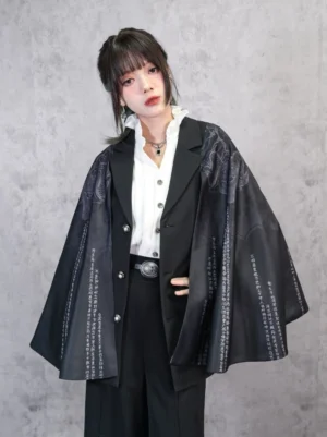 Front view of black Legend of the Immortals printed patchwork modern Hanfu cloak with Chinese cloud patterns, classical script details, cape sleeves, and metallic buttons