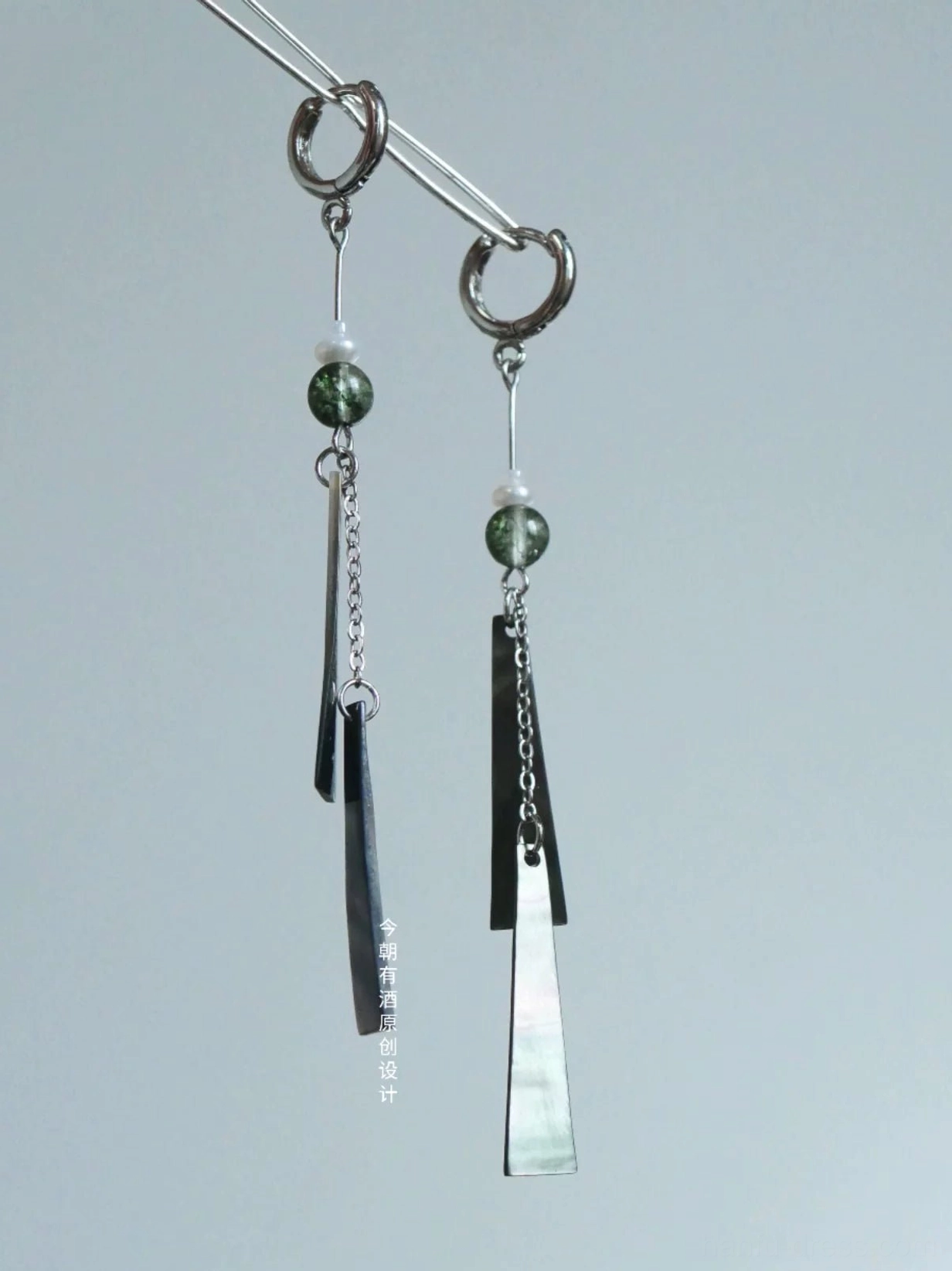 Comparison view of green bead Hanfu tassel earrings in hoop and hook styles with geometric shell pendants and chain tassels