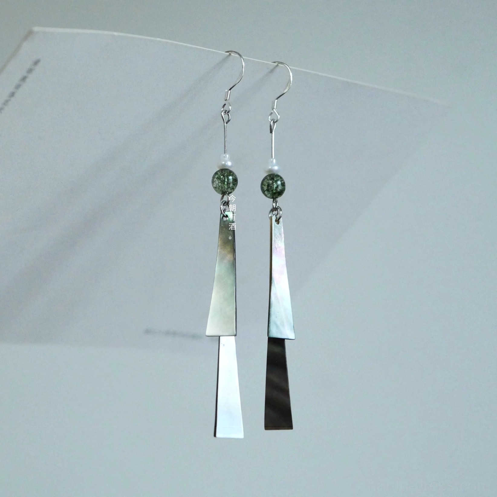 Letter from the Wind hook style Chinese tassel earrings with silver hooks green speckled beads and layered shell pendants