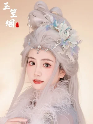Light blue Hanfu hair accessories set worn with an elegant updo, silver hair, floral metal hair jewelry, white feathers, and an ethereal Chinese-inspired costume