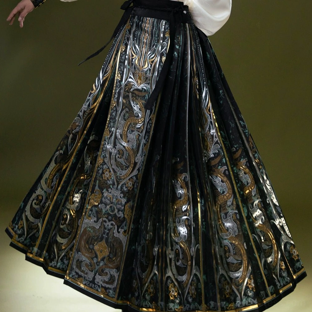 Detailed front view of the Light City embroidered mamianqun horse face skirt with dark patterns and gold decorative hem