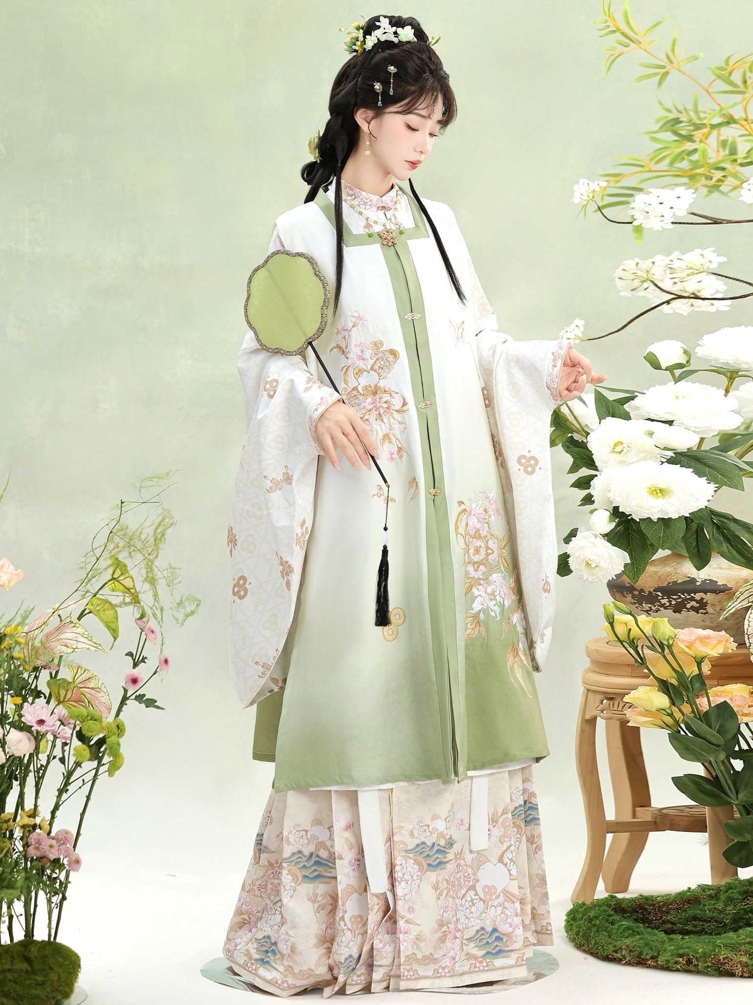 Light green Ming Dynasty Hanfu square collar vest with floral embroidery tassel waist detail and printed mamian skirt