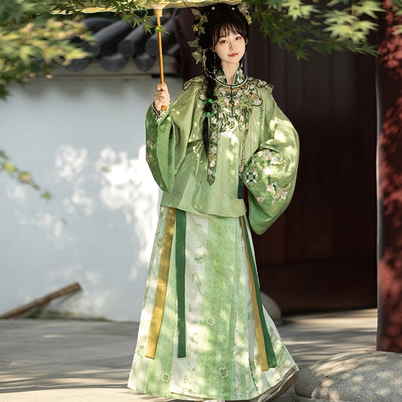 Light green Ming Dynasty Hanfu full set with floral embroidered cloud collar, pipa sleeve top and green color-blocked mamian skirt in classical garden