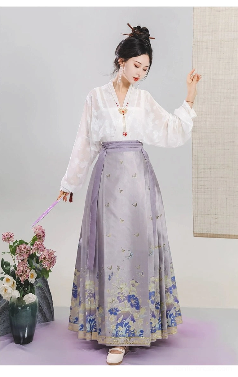Side view of light purple floral mamianqun horse face skirt with pleated sides and blue flower hem print in modern Hanfu styling