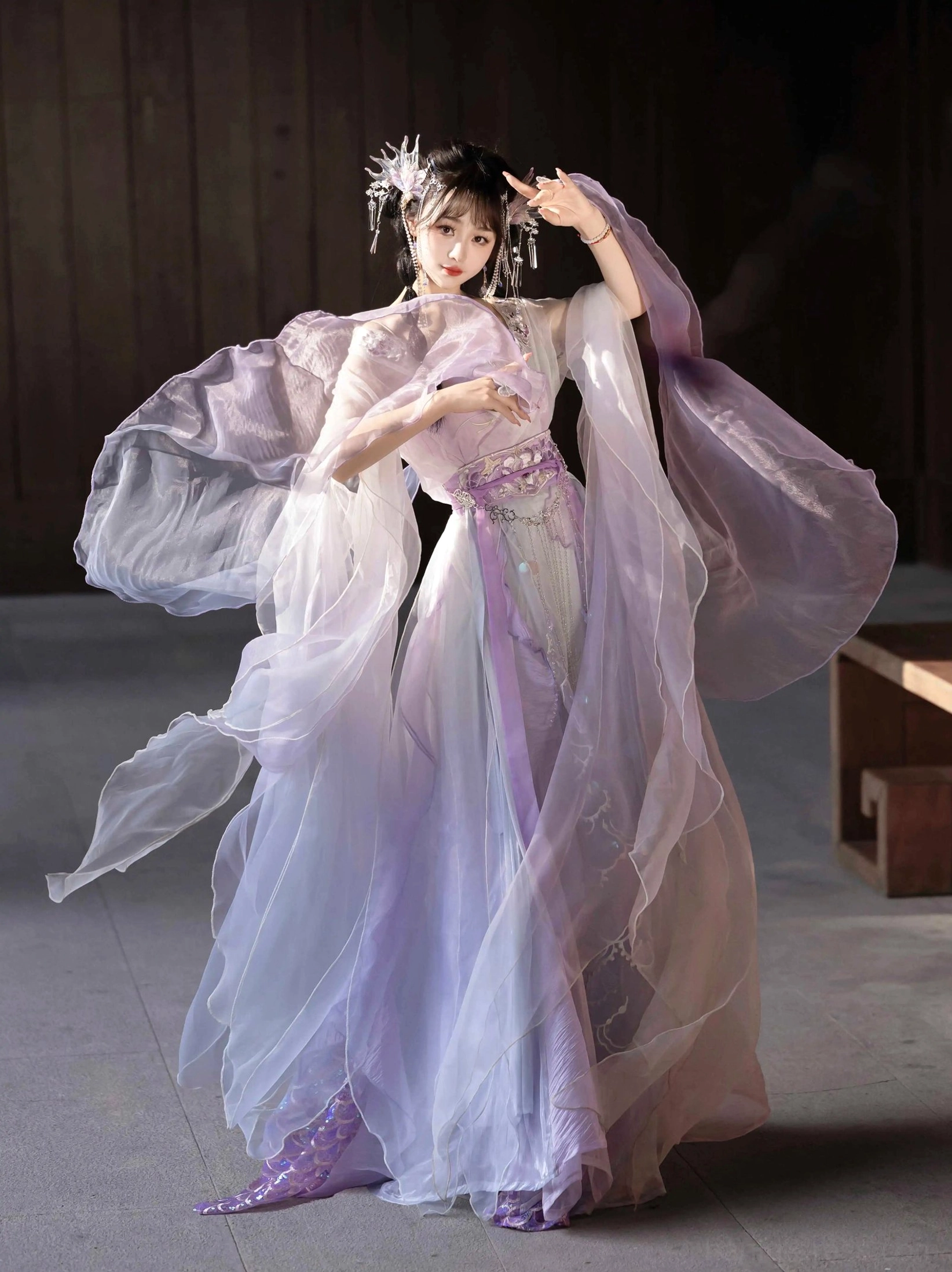 Light purple gradient Wei Jin Dynasty Hanfu three quarter view with flowing sheer sleeves decorative waist sash and fish scale embroidery along the skirt hem