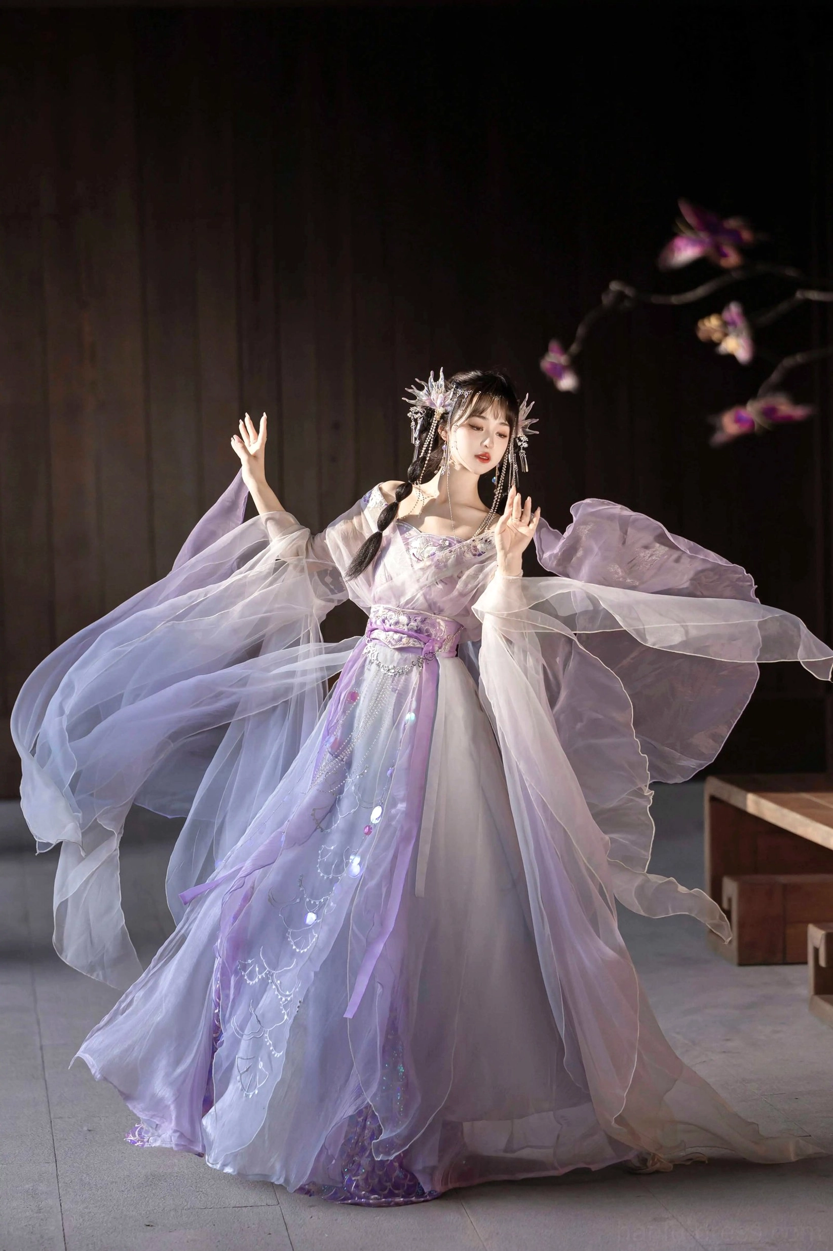 Light purple Wei Jin Dynasty Qiyao Ruqun Hanfu low angle view with ultra flowing translucent sleeves sequined gradient skirt decorative waistband and fairy hair accessories
