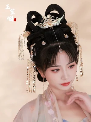 Three-quarter portrait showing ornate Chinese Hanfu hair accessories with a floral phoenix crown, side tassel hairpins, and delicate forehead pendant