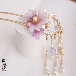 Lilac purple flower Chinese hanfu hair pin with pearl center, gold-tone details, and beaded tassels displayed on a white stand
