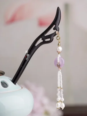 Close-up of lilac peace buckle pendant with pearl-like bead tassel from traditional Chinese Hanfu hair accessory set