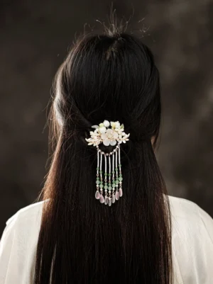 Lily Fountain Chinese Hanfu back tassel hair pin worn on long black half-up hair with white lily flowers, pearl strands, green beads, and pink teardrop pendants