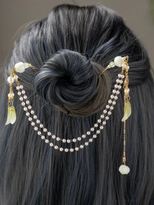 Rear overhead view of lily of the valley Hanfu hair chain hairpin with layered pearl tassels green leaf charms and dangling flower pendant