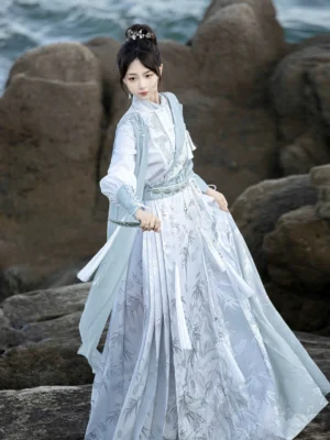 Side view of Lingyun modern Ming style Hanfu set showing blue layered top, decorative waist styling, and printed Mamianqun horse face skirt