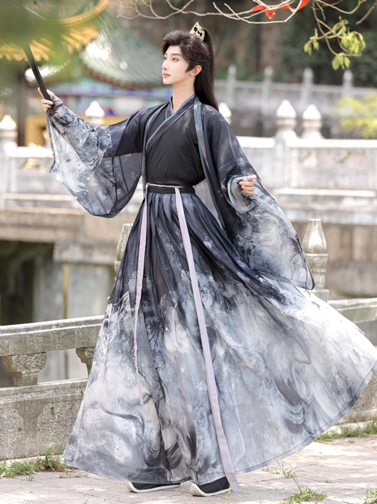 Dynamic side view of men’s black ink-wash Xianxia hanfu costume with flowing grey dragon print robe and lavender waist sash on a Chinese garden bridge