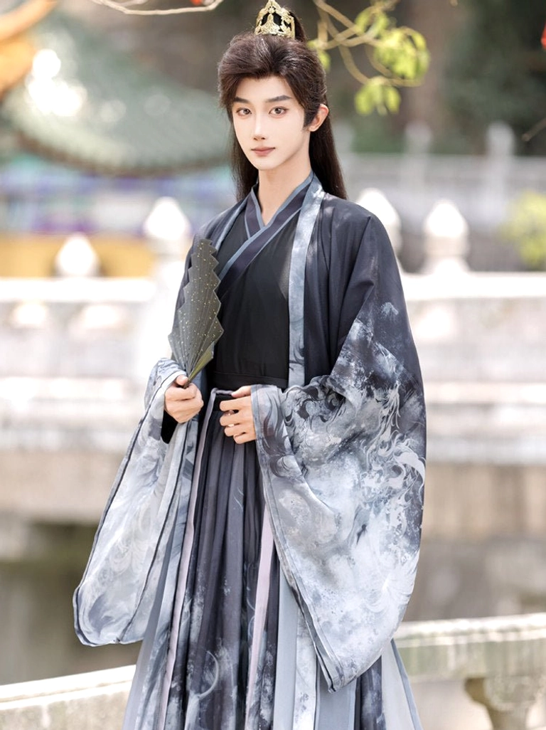 Close-up of black cross-collar inner top and grey ink-wash outer robe from men’s Xianxia hanfu set with folding fan and gold hair ornament