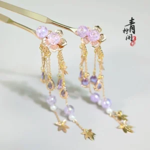 Side view of Linlang Chinese Hanfu hair pins with lavender flower beads, dangling tassels and gold tone metal charms