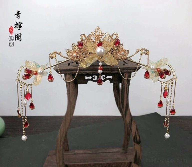 Red Linyu Chinese Hanfu floral hair crown on wooden display stand with red and white drop pendants and side chain tassels