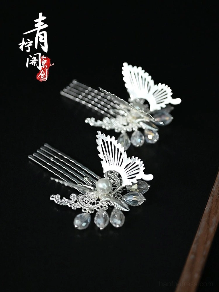 Silver butterfly hair comb pins for Hanfu featuring faux pearls, blue faceted drop pendants, and detailed metal butterfly wings