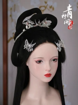 Silver butterfly Hanfu hair pins styled in a traditional Chinese hairstyle with pearl and blue dangling accents