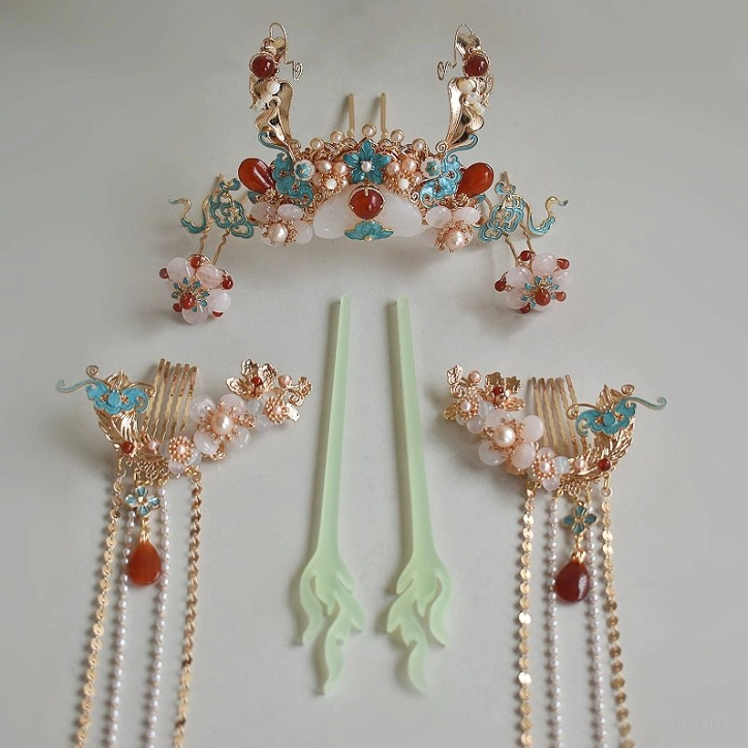 Complete Chinese Hanfu hair accessory set displayed from above with one decorative crown, two tassel hair combs, jade inspired hairpins, pearls, and cloisonne style details