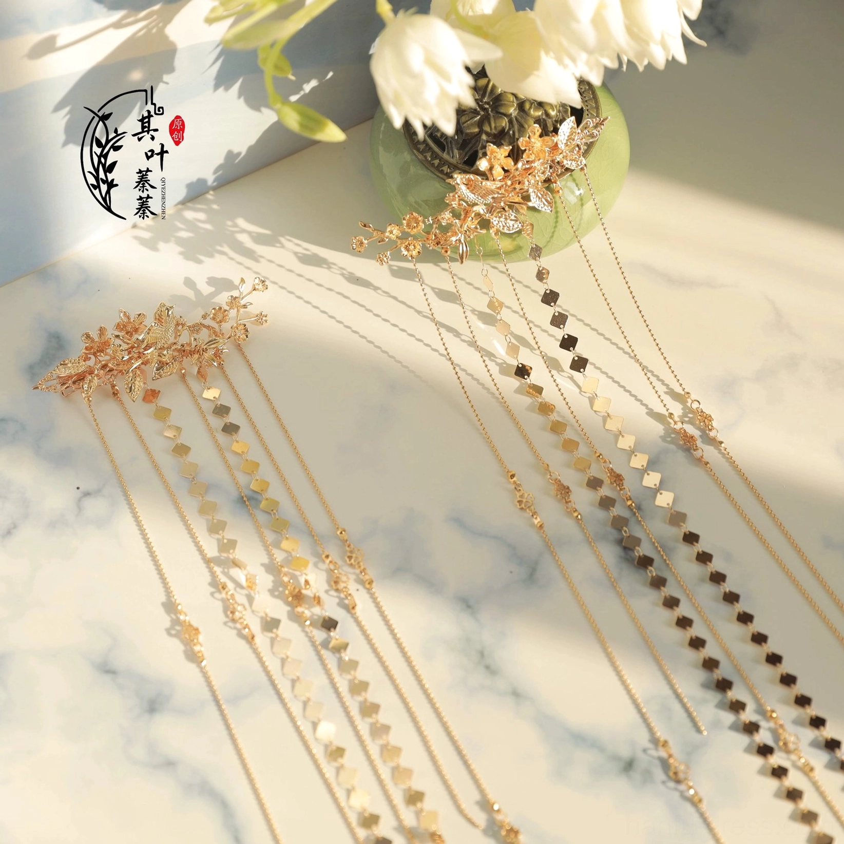 Full Liudai Hanfu hair accessories set with two vintage gold floral tassel hairpins, long layered chains, geometric pendants, and white flower styling