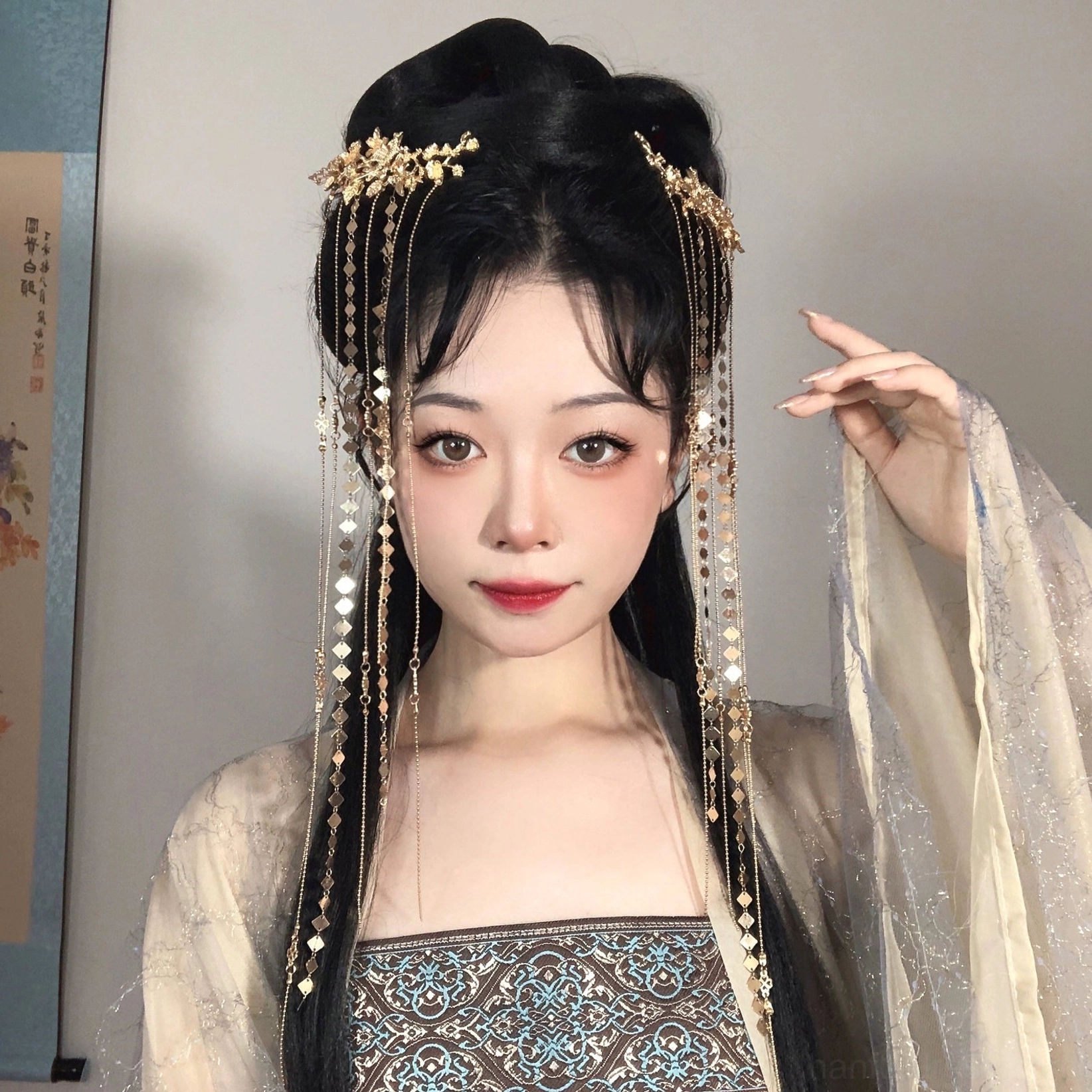 Model wearing Liudai Hanfu hair accessories with matching gold floral hairpins and long tassel chains styled with traditional Chinese clothing